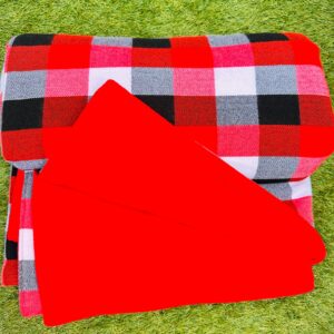 Eco Luxe Gifting red Maasai inspired picnic blanket styled outdoors on grass for premium sustainable gifting